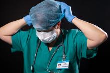 health professional putting on hair net