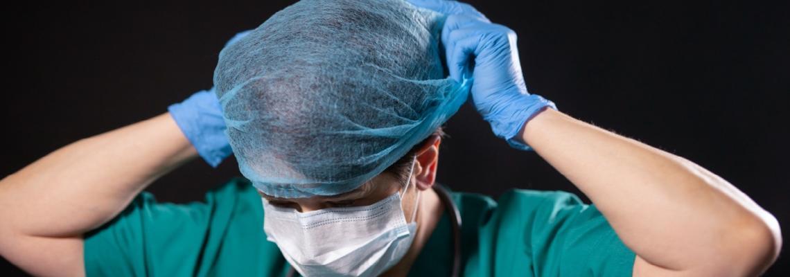 health professional putting on hair net